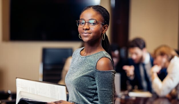 A woman taking a file